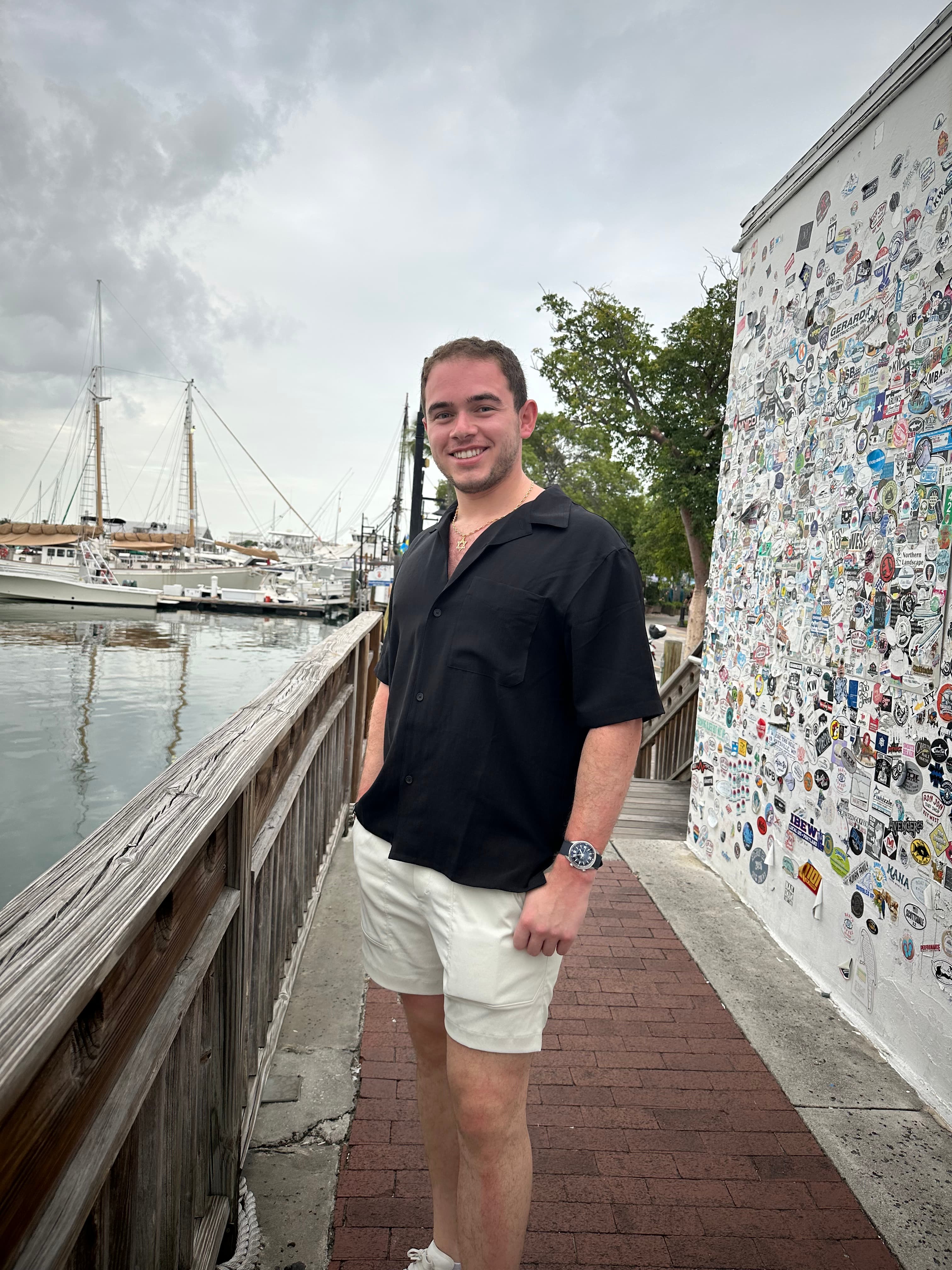Ryan Schwarz standing on a boardwalk by the water